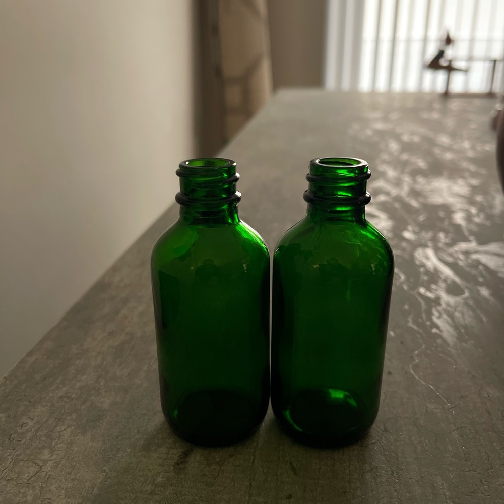 Vintage glass bottles green glass. Gorgeous,
flawless. Set of 2.